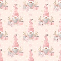 a pink and white christmas pattern with a santa clause hat on top of a box