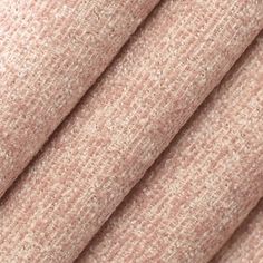 close up view of the fabric texture on a pink sweatering material, which is very soft