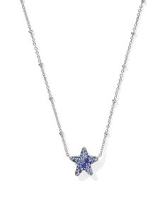 With the Jae Silver Star Pave Short Pendant Necklace in Blue Crystal, your stack has never looked more stellar. Set on a satellite chain, this star-shaped pendant sparkles thanks to its dazzling crystal detailing. Whether you’re rocking a game day fit or amping up an everyday look, this style will make you stand out. Metal Rhodium Over Brass Material Blue Crystal Closure Spring Ring Clasp Size 19" Chain ,0.46"L X 0.53"W PendantDue to the one-of-a-kind nature of the medium, exact colors and patterns may vary slightly from the image shown. | Kendra Scott Jae Silver Star Pave Short Pendant Necklace in Blue Crystal | Crystal/Metal Rhodium Cute Blue Necklace, Silver Kendra Scott Necklace, Blue And Silver Jewelry, Short Pendant Necklace, Star Necklace Silver, Kendra Scott Necklace, Stacked Necklaces, Blue Necklace, Earring Sale