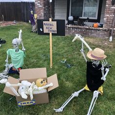 skeletons are sitting on the grass in front of a house with a sign that says making halloween friends