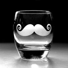 a glass with a mustache drawn on it