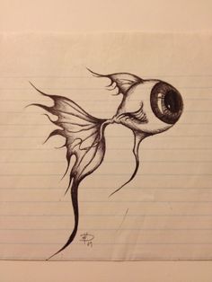 a drawing of a fish with an eye on it's head and tail, sitting on lined paper