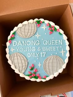 a cake in a box that says dancing queen young and sweet only 17