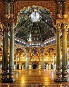 the inside of an ornate building with columns