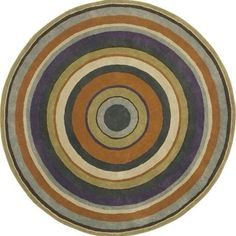 a circular rug with an orange, purple and green design