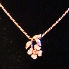 The Avon Delicate Cherry Blossom Gold Tone Necklace is an elegant and feminine piece that features a subtle gold-tone chain, accented with a dainty white enameled cherry blossom flower. The delicate flower appears to float gracefully along the chain, adding a touch of nature-inspired charm to any outfit. Measuring 16 inches in length, this necklace is perfect for layering or wearing on its own as a simple, understated accessory. It secures with a spring clasp, ensuring ease of wear while maintaining its sophisticated, timeless appeal. Ideal for lovers of floral-inspired jewelry. Cherry Blossom Flower, Cherry Blossom Flowers, Gold Tone Necklace, Blossom Flower, Delicate Flower, White Enamel, Nature Inspired, Cherry Blossom, Halloween Shopping