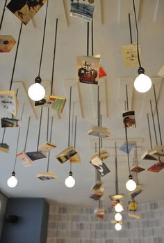 several different pictures of the inside of a restaurant with tables, chairs and books hanging from the ceiling