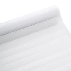 a roll of white paper sitting on top of a table