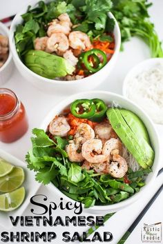 two white bowls filled with shrimp and veggies next to rice, cilantro