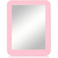 a pink mirror sitting on top of a white table