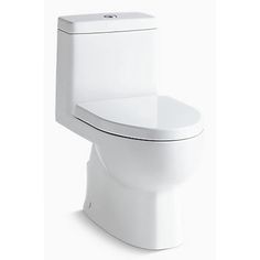 a white toilet sitting on top of a white floor