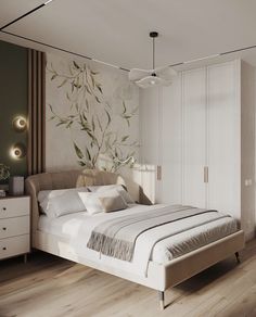 a bedroom with a bed, dressers and lamps on the wall above it is decorated with leaves