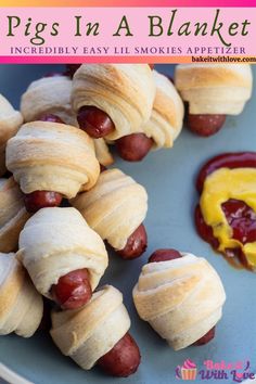 pigs in a blanket recipe on a plate with hotdogs and ketchup