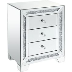 a mirrored cabinet with three drawers and silver glitters on the bottom drawer, in front of a white background