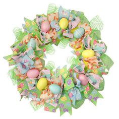 an easter wreath with colorful eggs and bows