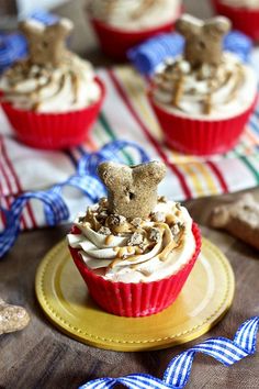 cupcakes with frosting and teddy bears on top