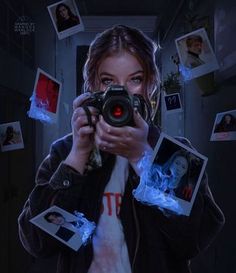 a woman holding a camera in front of her face with photos flying around the room