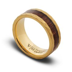 a wooden ring with gold inlays on the outside and inside, is shown