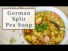 german split pea soup in a white bowl with a spoon and napkin on the side