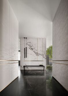 an empty room with marble walls and flooring