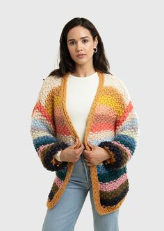 a woman wearing a multicolored cardigan sweater