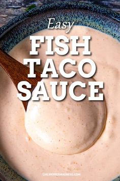 a bowl filled with taco sauce on top of a wooden spoon and the words easy fish taco sauce above it