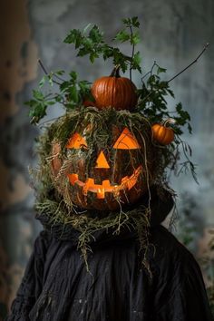 a person wearing a pumpkin costume with plants growing out of it's head and eyes