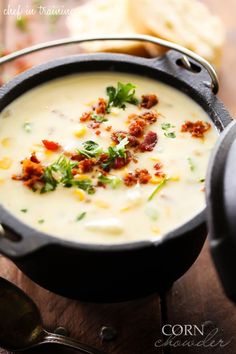 a pot filled with soup sitting on top of a wooden table