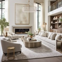 a living room filled with furniture and a fire place in the middle of a room