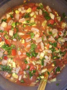 the food is prepared and ready to be cooked in the pot on the stove top