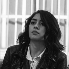 black and white photograph of a woman in leather jacket