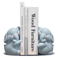 two little blue elephants sitting next to each other in front of a bookend with the words woop humptie on it