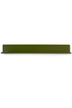 a green shelf sitting on top of a white wall