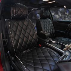 the interior of a car with black leather and studded trimmings on it