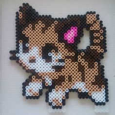 a close up of a cat made out of perler beads