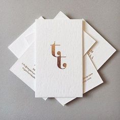 five cards with the letter j in gold foil on top of each card are stacked together