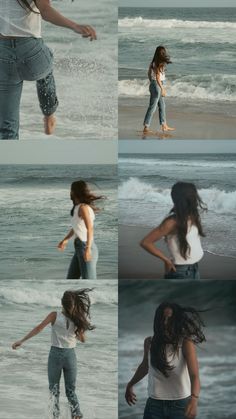 the woman is walking along the beach with her hair blowing in the wind and water