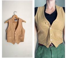 Vintage '80s vest in a wonderful tan. *length down front: 21"- 18" down the back *chest: 34"- model has a 35" bust- this best fits a true 34" or less- 33" would probably fit perfectly *waist: 29" *all cotton *2 pockets, leather buckle in back Great for layering! Medium weight- gorgeous wear. *all sales final* Corset Fashion Outfits, Light Academia Aesthetic, Corset Fashion, Cotton Vest, Academia Aesthetic, Light Academia, Leather Buckle, Style Board, Womens Vest