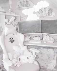 a child's room with white furniture and toys