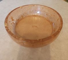 a brown bowl sitting on top of a table