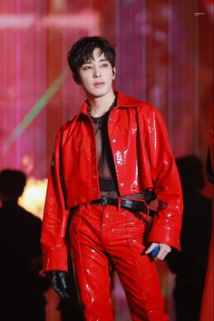 a male model in a red leather outfit