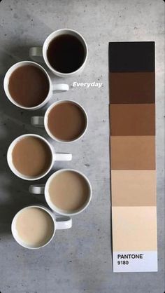 four cups of coffee sit in front of a pantone color swatch with five different colors