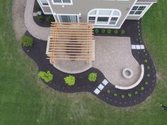 an aerial view of a house with landscaping