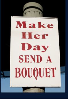 a sign that says make her day send a bouquet