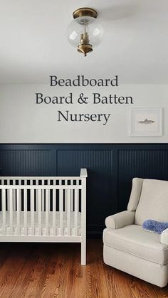 a baby's room with a white crib and blue walls