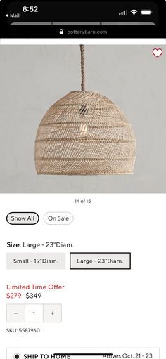 an image of a wicker lamp hanging from the ceiling with price label on it