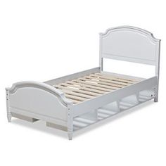 a white bed frame with wooden slats