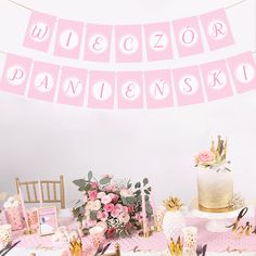 a pink and gold birthday party with cake, flowers, napkins and dessert table decorations