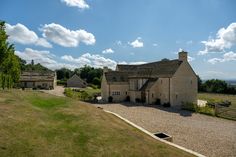 an aerial view of a large house in the countryside