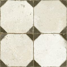 a white and grey tile floor with squares on it's sides, in different sizes